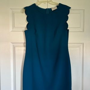 Beautiful and unique teal knee length work or play dress.